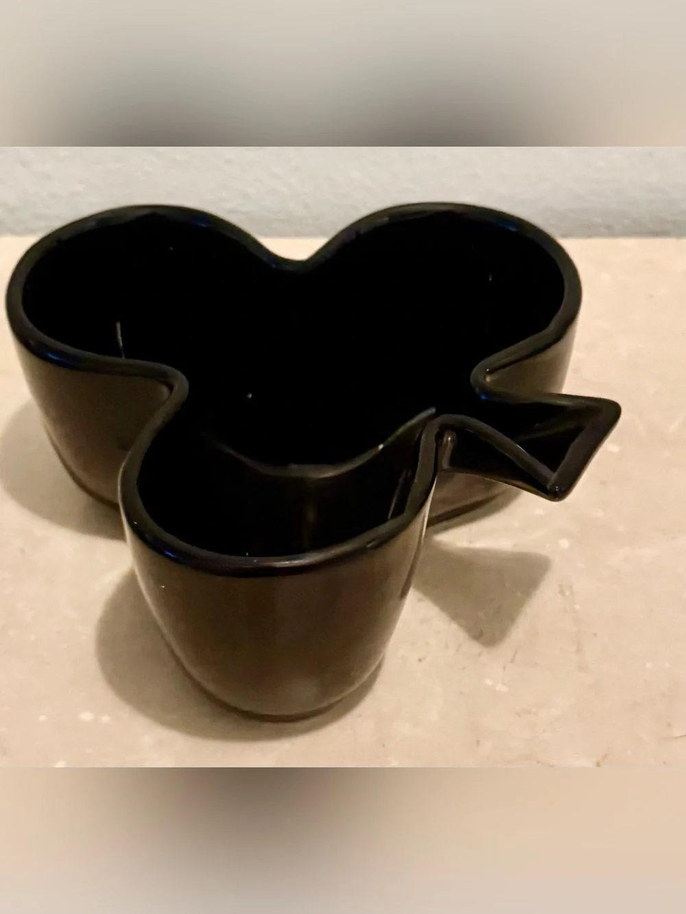 Sur La Table club-shaped, black ceramic snack bowl.